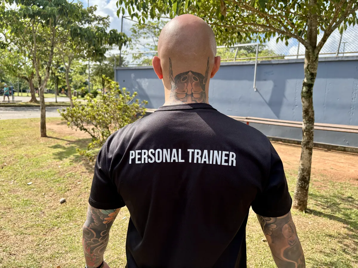 Professional trainer wearing Personal Trainer shirt